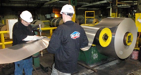 two Madi employees at work