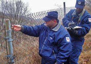 strike security officers checking perimeter fence of property