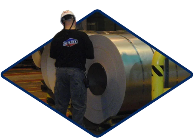 Mc Aerospace Defense Man Saftey Hat Inspecting Rolls Of Material